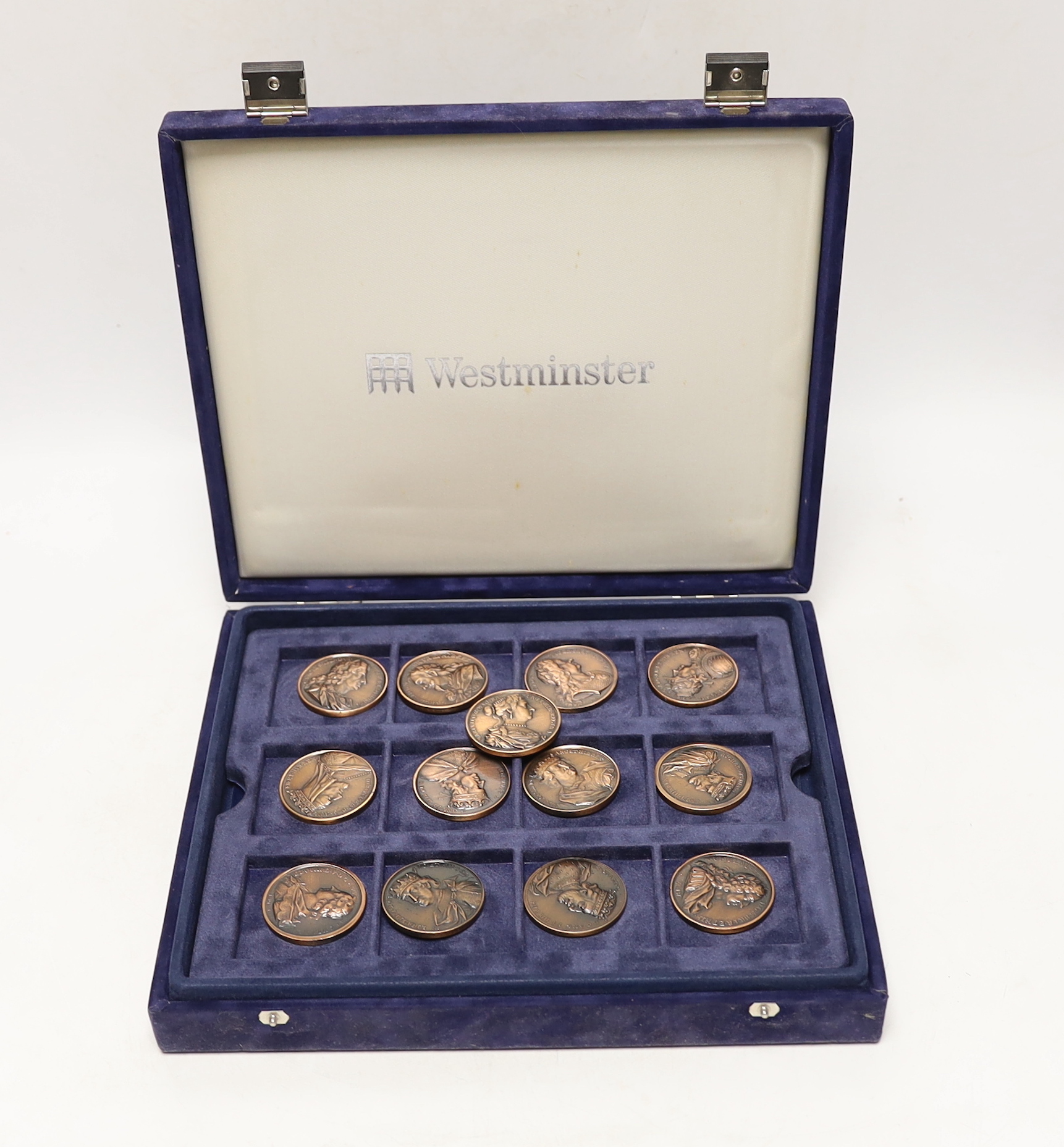 A cased set of Westminster Jean Dassier Collection AE Commemorative Monarchs of Britain medals.